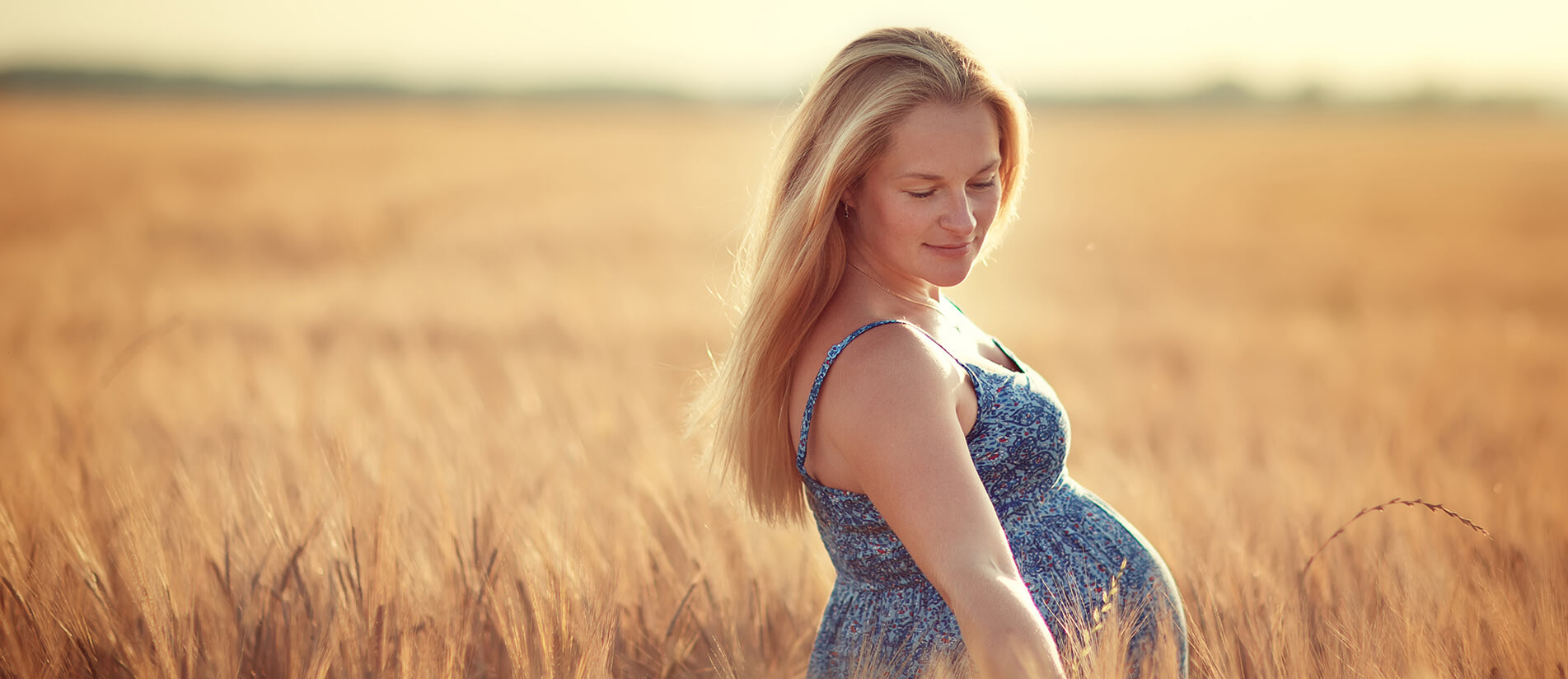 Pregnant woman in a field